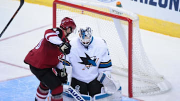 Oct 2, 2015; Glendale, AZ, USA; San Jose Sharks goalie Martin Jones (31) makes a save on Arizona Coyotes left wing Jordan Martinook (48) during the third period at Gila River Arena. Mandatory Credit: Matt Kartozian-USA TODAY Sports