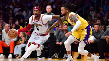 May 22, 2023; Los Angeles, California, USA; Denver Nuggets guard Kentavious Caldwell-Pope (5) drives to the basket against Los Angeles Lakers guard D'Angelo Russell (1) during the first quarter in game four of the Western Conference Finals for the 2023 NBA playoffs at Crypto.com Arena. Mandatory Credit: Gary A. Vasquez-USA TODAY Sports