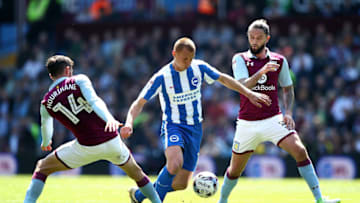 BIRMINGHAM, ENGLAND - MAY 07: Steve Sidwell of Brighton and Hove Albion competes for the ball with Conor Hourihane(L) and Henri Lansbury of Aston Villa the Sky Bet Championship match between Aston Villa and Brighton