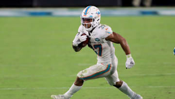 JACKSONVILLE, FLORIDA - SEPTEMBER 24: Myles Gaskin #37 of the Miami Dolphins runs for yardage during the game against the Jacksonville Jaguars at TIAA Bank Field on September 24, 2020 in Jacksonville, Florida. (Photo by Sam Greenwood/Getty Images)