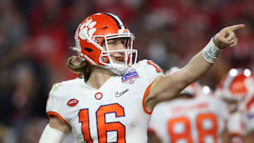 GLENDALE, ARIZONA - DECEMBER 28: Trevor Lawrence #16 of the Clemson Tigers celebrates his 34-yard touchdown pass to Travis Etienne (not pictured) against the Ohio State Buckeyes in the second half during the College Football Playoff Semifinal at the PlayStation Fiesta Bowl at State Farm Stadium on December 28, 2019 in Glendale, Arizona. (Photo by Matthew Stockman/Getty Images)