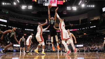 Giannis Antetokounmpo #34 of the Milwaukee Bucks attempts a shot while being guarded by Dwyane Wade #3 and Hassan Whiteside #21 of the Miami Heat(Photo by Dylan Buell/Getty Images)