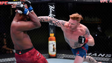 LAS VEGAS, NEVADA - SEPTEMBER 12: (R-L) Ed Herman punches Mike Rodriguez in a light heavyweight fight during the UFC Fight Night event at UFC APEX on September 12, 2020 in Las Vegas, Nevada. (Photo by Jeff Bottari/Zuffa LLC)