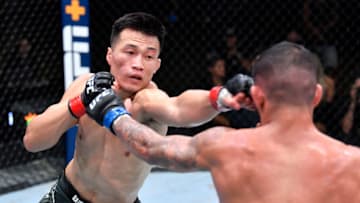 LAS VEGAS, NEVADA - JUNE 19: (L-R) 'The Korean Zombie' Chan Sung Jung of South Korea punches Dan Ige in a featherweight bout during the UFC Fight Night event at UFC APEX on June 19, 2021 in Las Vegas, Nevada. (Photo by Chris Unger/Zuffa LLC)