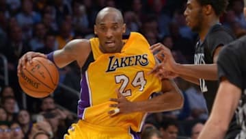 Feb 2, 2016; Los Angeles, CA, USA; Minnesota Timberwolves guard Andrew Wiggins (22) defends Los Angeles Lakers forward Kobe Bryant (24) in the second half of the game at Staples Center. Lakers won 119-115. Mandatory Credit: Jayne Kamin-Oncea-USA TODAY Sports