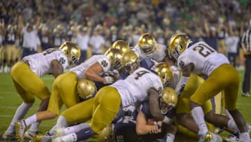 SAN DIEGO, CA - OCTOBER 27: Zach Abey #9 of the Navy Midshipmen carries the ball across the goal line scoring a touchdown in the 2nd half against the Notre Dame Fighting Irish at SDCCU Stadium on October 27, 2018 in San Diego, California. (Photo by Kent Horner/Getty Images)