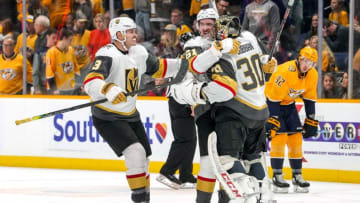 NASHVILLE, TN - NOVEMBER 27: Malcolm Subban #30 celebrates an overtime win with Mark Stone #61 and Brayden McNabb #3 against the Nashville Predators at Bridgestone Arena on November 27, 2019 in Nashville, Tennessee. (Photo by John Russell/NHLI via Getty Images)
