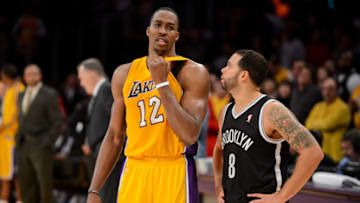 LOS ANGELES, CA - NOVEMBER 20: Dwight Howard #12 of the Los Angeles Lakers and Deron Williams #8 of the Brooklyn Nets speak during their game at Staples Center on November 20, 2012 in Los Angeles, California. NOTE TO USER: User expressly acknowledges and agrees that, by downloading and/or using this Photograph, user is consenting to the terms and conditions of the Getty Images License Agreement. Mandatory Copyright Notice: Copyright 2012 NBAE (Photo by Noah Graham/NBAE via Getty Images)