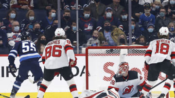 Winnipeg Jets center Mark Scheifele (55) scores on New Jersey Devils goaltender Jonathan Bernier (45) in the first period at Canada Life Centre. Mandatory Credit: James Carey Lauder-USA TODAY Sports