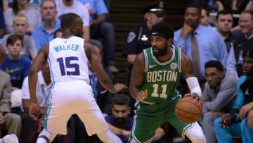 CHAPEL HILL, NC - SEPTEMBER 28: Kyrie Irving #11 of the Boston Celtics moves the ball against Kemba Walker #15 of the Charlotte Hornets in the first quarter of a preseason game at Dean Smith Center on September 28, 2018 in Chapel Hill, North Carolina. NOTE TO USER: User expressly acknowledges and agrees that, by downloading and or using this photograph, User is consenting to the terms and conditions of the Getty Images License Agreement. The Hornets won 104-97. (Photo by Lance King/Getty Images)