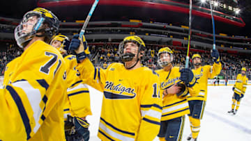 Dakota Raabe #12 of the Michigan Wolverines as teammates salute the fans after the annual NCAA hockey game against the Michigan State Spartans during the Duel in the D at Little Caesars Arena on February 17, 2020 in Detroit, Michigan. The Wolverines defeated the Spartans 4-1. (Photo by Dave Reginek/Getty Images)
