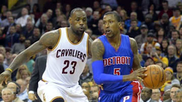 Feb 22, 2016; Cleveland, OH, USA; Detroit Pistons guard Kentavious Caldwell-Pope (5) dribbles against Cleveland Cavaliers forward LeBron James (23) in the first quarter at Quicken Loans Arena. Mandatory Credit: David Richard-USA TODAY Sports