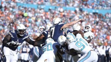 Nov 2, 2014; Miami Gardens, FL, USA; Miami Dolphins defensive end Olivier Vernon (50) and Miami Dolphins defensive end Cameron Wake (91) sack San Diego Chargers quarterback Philip Rivers (17) at Sun Life Stadium. The Dolphins won 37-0. Mandatory Credit: Brad Barr-USA TODAY Sports