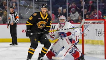 LAVAL, QC, CANADA - OCTOBER 16: Charlie Lindgren #35 of the Laval Rocket and Paul Carey #28 of the Providence Bruins wait for a shot on net at Place Bell on October 16, 2019 in Laval, Quebec. (Photo by Stephane Dube /Getty Images)