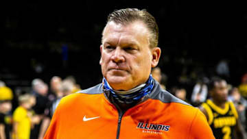 Illinois head coach Brad Underwood walks onto the court before a NCAA Big Ten Conference men's basketball game against Iowa, Monday, Dec. 6, 2021, at Carver-Hawkeye Arena in Iowa City, Iowa.211206 Ill Iowa Mbb 030 Jpg