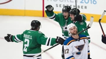 Mar 12, 2016; Dallas, TX, USA; Dallas Stars defenseman Kris Russell (2) and left wing Jamie Benn (14) and center Jason Spezza (90) celebrate Benn
