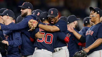 NEW YORK, NY - SEPTEMBER 20: Xander Bogaerts #2 and Mookie Betts #50 of the Boston Red Sox celebrate after defeating the New York Yankees at Yankee Stadium on September 20, 2018 in the Bronx borough of New York City. (Photo by Jim McIsaac/Getty Images)