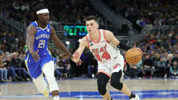 Tyler Herro #14 of the Miami Heat is defended by Jrue Holiday #21 of the Milwaukee Bucks(Photo by Stacy Revere/Getty Images)