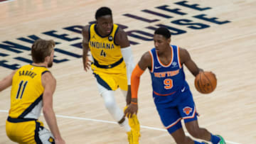 Dec 23, 2020; Indianapolis, Indiana, USA; New York Knicks guard RJ Barrett (9) dribbles the ball while Indiana Pacers guard Victor Oladipo (4) defends in the fourth quarter at Bankers Life Fieldhouse. Mandatory Credit: Trevor Ruszkowski-USA TODAY Sports