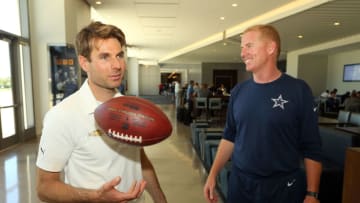 FRISCO, TX - MAY 30: Indianapolis 500 Champion WIll Power tosses an autographed football given to him by Dallas Cowboys head coach Jason Garrett after practice at The Ford Center at The Star on May 30, 2018 in Frisco, Texas. (Photo by Richard Rodriguez/Getty Images)