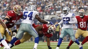 Sep 7, 2014; Arlington, TX, USA; San Francisco 49ers running back Carlos Hyde (28) scores a touchdown while being tackled by Dallas Cowboys outside linebacker Bruce Carter (54) in the second quarter at AT&T Stadium. Mandatory Credit: Tim Heitman-USA TODAY Sports