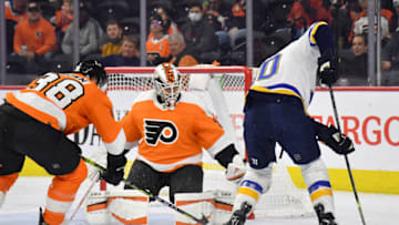 Feb 22, 2022; Philadelphia, Pennsylvania, USA; Philadelphia Flyers center Patrick Brown (38) and goaltender Martin Jones (35) battle against St. Louis Blues center Ryan O'Reilly (90) during the first period at Wells Fargo Center. Mandatory Credit: Eric Hartline-USA TODAY Sports