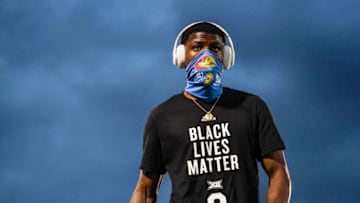 Sep 12, 2020; Lawrence, Kansas, USA; Kansas Jayhawks cornerback Karon Prunty (9) wears a Black Lives Matter shirt during warmups before a game against the Coastal Carolina Chanticleers at David Booth Kansas Memorial Stadium. Mandatory Credit: Jay Biggerstaff-USA TODAY Sports