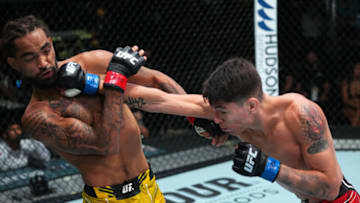 LAS VEGAS, NEVADA - AUGUST 21: (R-L) Ignacio Bahamondes of Chile punches Roosevelt Roberts in a lightweight fight during the UFC Fight Night event at UFC APEX on August 21, 2021 in Las Vegas, Nevada. (Photo by Chris Unger/Zuffa LLC)