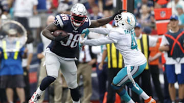 Sep 18, 2016; Foxborough, MA, USA; Miami Dolphins cornerback Byron Maxwell (41) attempts to tackle New England Patriots tight end Martellus Bennett (88) during the third quarter at Gillette Stadium. The New England Patriots won 31-24. Mandatory Credit: Greg M. Cooper-USA TODAY Sports