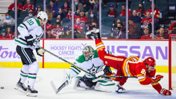 Nov 4, 2021; Calgary, Alberta, CAN; Dallas Stars goaltender Anton Khudobin (35) and Calgary Flames center Blake Coleman (20) collide during the first period at Scotiabank Saddledome. Mandatory Credit: Sergei Belski-USA TODAY Sports