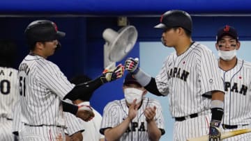 Aug 2, 2021; Yokohama, Japan; Team Japan outfielder Seiya Suzuki (51) celebrates after scoring a run against USA in a second round baseball game during the Tokyo 2020 Olympic Summer Games at Yokohama Baseball Stadium. Mandatory Credit: Mandi Wright-USA TODAY Sports