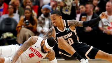 ATLANTA, GEORGIA - JANUARY 18: John Collins #20 of the Atlanta Hawks and Markieff Morris #8 of the Detroit Pistons dive for a loose ball in the first half at State Farm Arena on January 18, 2020 in Atlanta, Georgia. NOTE TO USER: User expressly acknowledges and agrees that, by downloading and/or using this photograph, user is consenting to the terms and conditions of the Getty Images License Agreement. (Photo by Kevin C. Cox/Getty Images)