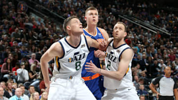 SALT LAKE CITY, UT - JANUARY 19: Jonas Jerebko #8 and Joe Ingles #2 of the Utah Jazz and Kristaps Porzingis #6 of the New York Knicks react to a play during the game on January 19, 2018 at vivint.SmartHome Arena in Salt Lake City, Utah. Copyright 2018 NBAE (Photo by Melissa Majchrzak/NBAE via Getty Images)