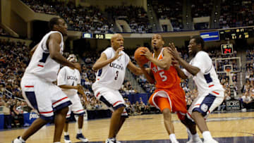 HARTFORD, CT - FEBRUARY 2: Josh Pace #5 of the Syracuse Orangemen drives to the basket against the UCONN Huskies on February 2, 2004 at the Hartford Civic Center in Hartford, Connecticut. UCONN won 84-56. (Photo by Ezra Shaw/Getty Images)