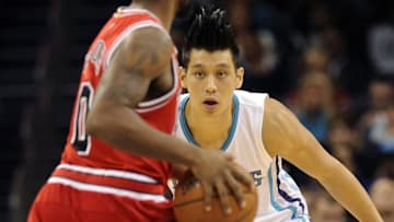 Nov 3, 2015; Charlotte, NC, USA; Charlotte Hornets guard Jeremy Lin (7) guards Chicago Bulls Aaron Brooks (0) during the first half of the game at Time Warner Cable Arena. Mandatory Credit: Sam Sharpe-USA TODAY Sports
