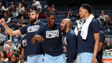 MEMPHIS, TN - FEBRUARY 12: Jaren Jackson #13 and Jevon Carter #3 of the Memphis Grizzlies react to a play during the game against the San Antonio Spurs on February 12, 2019 at FedExForum in Memphis, Tennessee. NOTE TO USER: User expressly acknowledges and agrees that, by downloading and or using this photograph, User is consenting to the terms and conditions of the Getty Images License Agreement. Mandatory Copyright Notice: Copyright 2019 NBAE (Photo by Joe Murphy/NBAE via Getty Images)