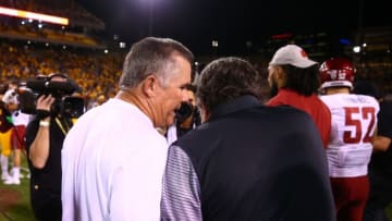 Oct 22, 2016; Tempe, AZ, USA; Arizona State Sun Devils head coach Todd Graham (left) confronts Washington State Cougars head coach Mike Leach after a handshake following the game at Sun Devil Stadium. Mandatory Credit: Mark J. Rebilas-USA TODAY Sports
