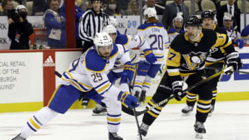Nov 16, 2021; Pittsburgh, Pennsylvania, USA; Buffalo Sabres left wing Vinnie Hinostroza (29) skates with the puck ahead of Pittsburgh Penguins right wing Bryan Rust (17) during the third period at PPG Paints Arena. Buffalo won 2-1. Mandatory Credit: Charles LeClaire-USA TODAY Sports