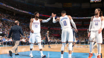 OKLAHOMA CITY, OK - MARCH 30: Paul George #13 and Russell Westbrook #0 of the Oklahoma City Thunder react to a play during the game against the Denver Nuggets on March 30, 2018 at Chesapeake Energy Arena in Oklahoma City, Oklahoma. NOTE TO USER: User expressly acknowledges and agrees that, by downloading and/or using this photograph, user is consenting to the terms and conditions of the Getty Images License Agreement. Mandatory Copyright Notice: Copyright 2018 NBAE (Photo by Layne Murdoch/NBAE via Getty Images)
