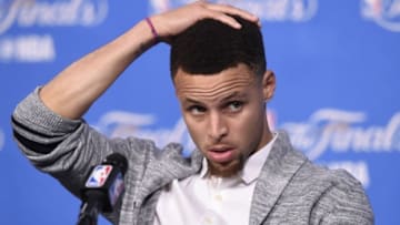Jun 16, 2016; Cleveland, OH, USA; Golden State Warriors guard Stephen Curry (30) speaks to the media after game six of the NBA Finals against the Cleveland Cavaliers at Quicken Loans Arena. The Cavaliers won 115-101. Mandatory Credit: David Richard-USA TODAY Sports