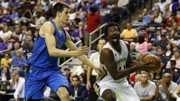 Oct 1, 2016; Bossier City, LA, USA; New Orleans Pelicans forward Solomon Hill (44) goes to the basket on Dallas Mavericks forward Nicolas Brussino (9) during the second half at CenturyLink Center. New Orleans won 116-102. Mandatory Credit: Ray Carlin-USA TODAY Sports
