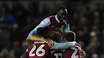 BRIGHTON, ENGLAND - NOVEMBER 18: Nathan Baker of Aston Villa is mobbed by team mates after scoring during the Sky Bet Championship match between Brighton