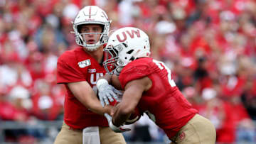 MADISON, WISCONSIN - SEPTEMBER 28: Jack Coan #17 of the Wisconsin Badgers hands ball off to Jonathan Taylor #23 in the third quarter against the Northwestern Wildcats at Camp Randall Stadium on September 28, 2019 in Madison, Wisconsin. (Photo by Dylan Buell/Getty Images)