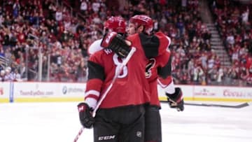 Dec 17, 2015; Glendale, AZ, USA; Arizona Coyotes center Tobias Rieder (8) celebrates with defenseman Oliver Ekman-Larsson (23) after scoring a goal in the second period against the Columbus Blue Jackets at Gila River Arena. Mandatory Credit: Matt Kartozian-USA TODAY Sports