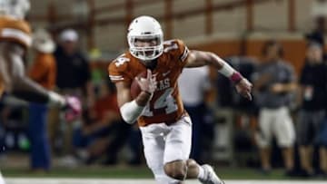 Sep 21, 2013; Austin, TX, USA; Texas Longhorns quarterback David Ash (14) runs against the Kansas State Wildcats during the first half of a football game at Darrell K Royal-Texas Memorial Stadium. Mandatory Credit: Jim Cowsert-USA TODAY Sports