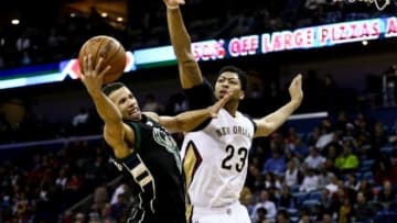 Jan 23, 2016; New Orleans, LA, USA; Milwaukee Bucks guard Michael Carter-Williams (5) shoots over New Orleans Pelicans forward Anthony Davis (23) during the first half of a game at the Smoothie King Center. Mandatory Credit: Derick E. Hingle-USA TODAY Sports