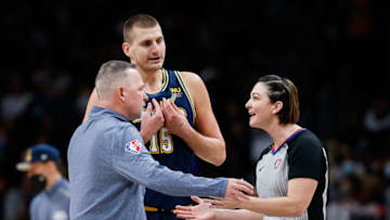 Denver Nuggets head coach Michael Malone argues a call with referee Lauren Holtkamp-Sterling (7) as center Nikola Jokic (15) gestures in the second quarter against the Houston Rockets at Ball Arena on 6 Nov. 2021. (Isaiah J. Downing-USA TODAY Sports)