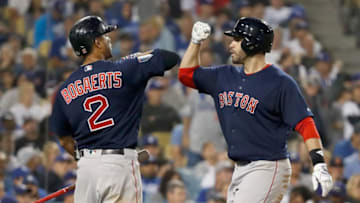 LOS ANGELES, CA - OCTOBER 28: J.D. Martinez #28 of the Boston Red Sox is congratulated by his teammate Xander Bogaerts #2 after his seventh inning home run against the Los Angeles Dodgers in Game Five of the 2018 World Series at Dodger Stadium on October 28, 2018 in Los Angeles, California. (Photo by Sean M. Haffey/Getty Images)