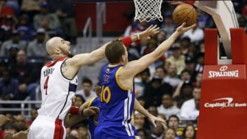 Jan 5, 2014; Washington, DC, USA; Golden State Warriors power forward David Lee (10) shoots the ball as Washington Wizards center Marcin Gortat (4) defends in the first quarter at Verizon Center. Mandatory Credit: Geoff Burke-USA TODAY Sports