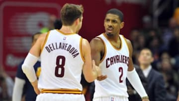 Jan 4, 2016; Cleveland, OH, USA; Cleveland Cavaliers guard Matthew Dellavedova (8) and guard Kyrie Irving (2) celebrate during the fourth quarter against the Toronto Raptors at Quicken Loans Arena. Mandatory Credit: Ken Blaze-USA TODAY Sports